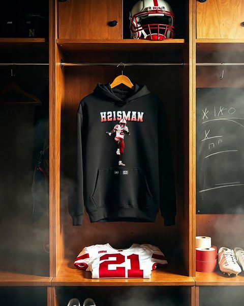 Emmett Johnson wearing H21SMAN hoodie in Nebraska locker room — Emmett Johnson x We're Back Co.